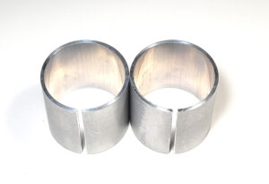 Top Aluminum fork sleeves (2) to eliminate top out clunk